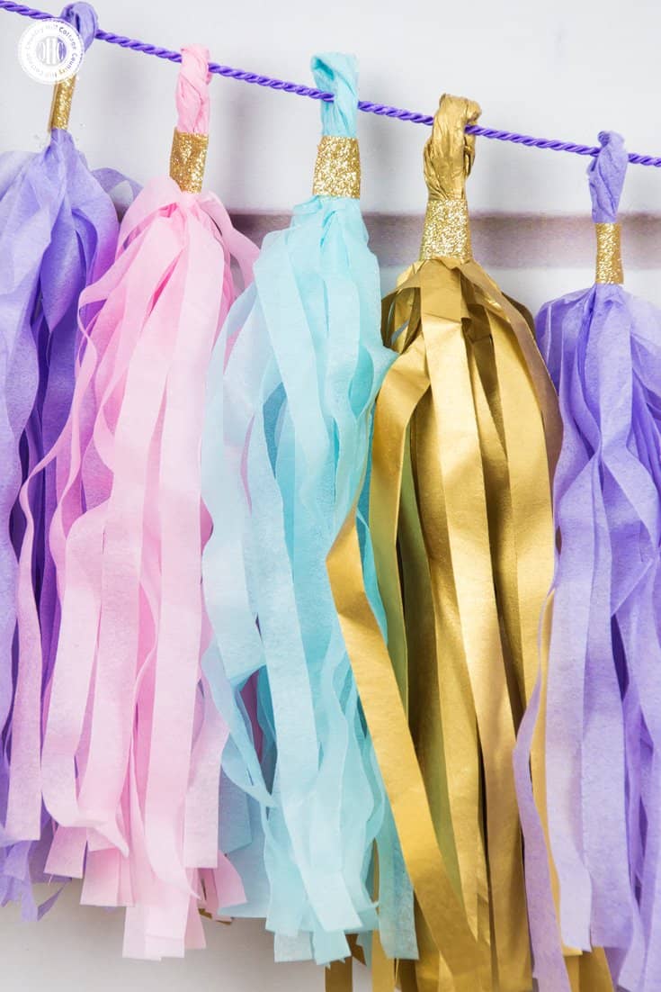 Learn to craft a beautiful tassel garland in 4 easy steps made from tissue paper. This garland looks great as decoration for parties, wedding receptions, and dessert tables. #papercrafts #tissuepaper #paperdecor | countryhillcottage.com