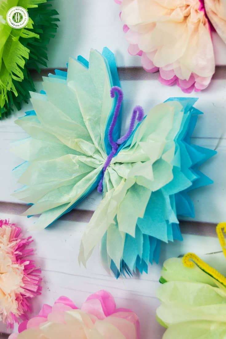 Frilly tissue paper butterflies are a beautiful decoration for parties and weddings! In this paper craft DIY, we show an easy technique to create colourful and elegant butterflies using tissue paper and pipe cleaner. #papercrafts #DIY #decor | countryhillcottage.com