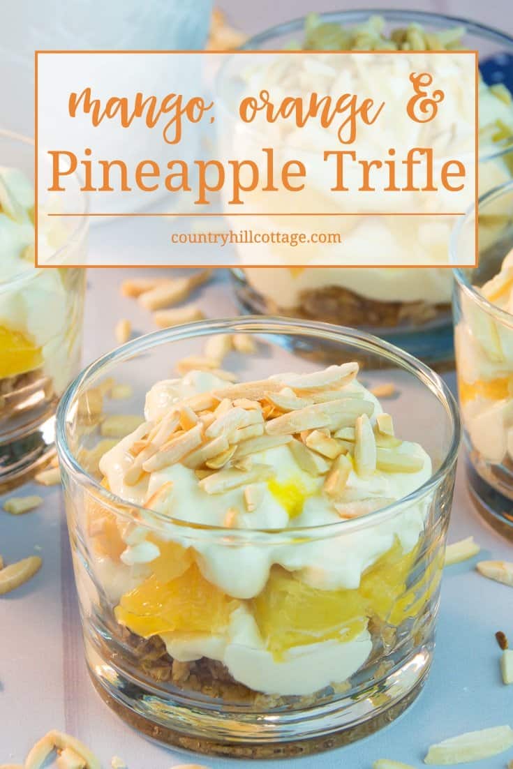 Our mango orange pineapple trifle is made of delicious layers of crushed granola, roasted almonds, fresh pineapple, mango sauce and creamy clotted cream. It tastes both luxurious and creamy, as well as fruity and airy! #dessert #recipe #trifle | countryhillcottage.com