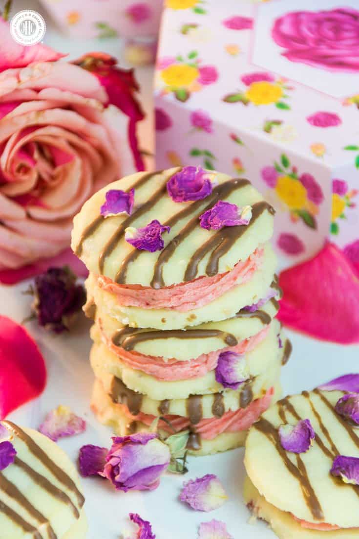 Our strawberry rose meltaways have a delicate, melt-in-your mouth texture. These biscuits are made with dried rose petals, and filled with an airy strawberry and rosewater buttercream. #strawberry #rose #cookies | countryhillcottage.com Our strawberry rose meltaways have a delicate, melt-in-your mouth texture. These biscuits are made with dried rose petals, and filled with an airy strawberry and rosewater buttercream. #strawberry #rose #cookies | countryhillcottage.com
