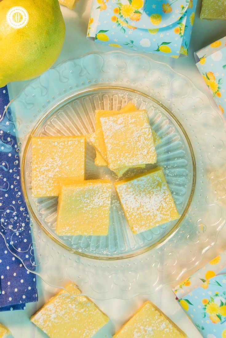 Layer a crumbly crust with a flavorful lemon topping to create creamy lemon squares! Dusted with icing sugar, these bars are perfect to serve with tea, or as a delicious present for all lemon lovers. You can find printable treat boxes to gift the lemon squares at our blog. #lemonsquares #baking #recipe | countryhillcottage.com Layer a crumbly crust with a flavorful lemon topping to create creamy lemon squares! Dusted with icing sugar, these bars are perfect to serve with tea, or as a delicious present for all lemon lovers. You can find printable treat boxes to gift the lemon squares at our blog. #lemonsquares #baking #recipe | countryhillcottage.com