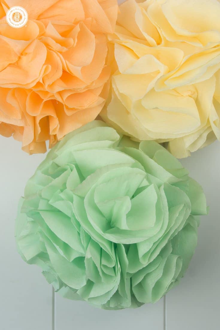 Learn how to make beautiful ruffle pom poms in this quick and easy DIY! You can make the pom poms with crepe paper, tissue paper, or fabric. Ruffle pom poms look very fluffy and elegant and are a great decoration for weddings, showers, parties and home décor.|countryhillcottage.com Learn how to make beautiful ruffle pom poms in this quick and easy DIY! You can make the pom poms with crepe paper, tissue paper, or fabric. Ruffle pom poms look very fluffy and elegant and are a great decoration for weddings, showers, parties and home décor.|countryhillcottage.com