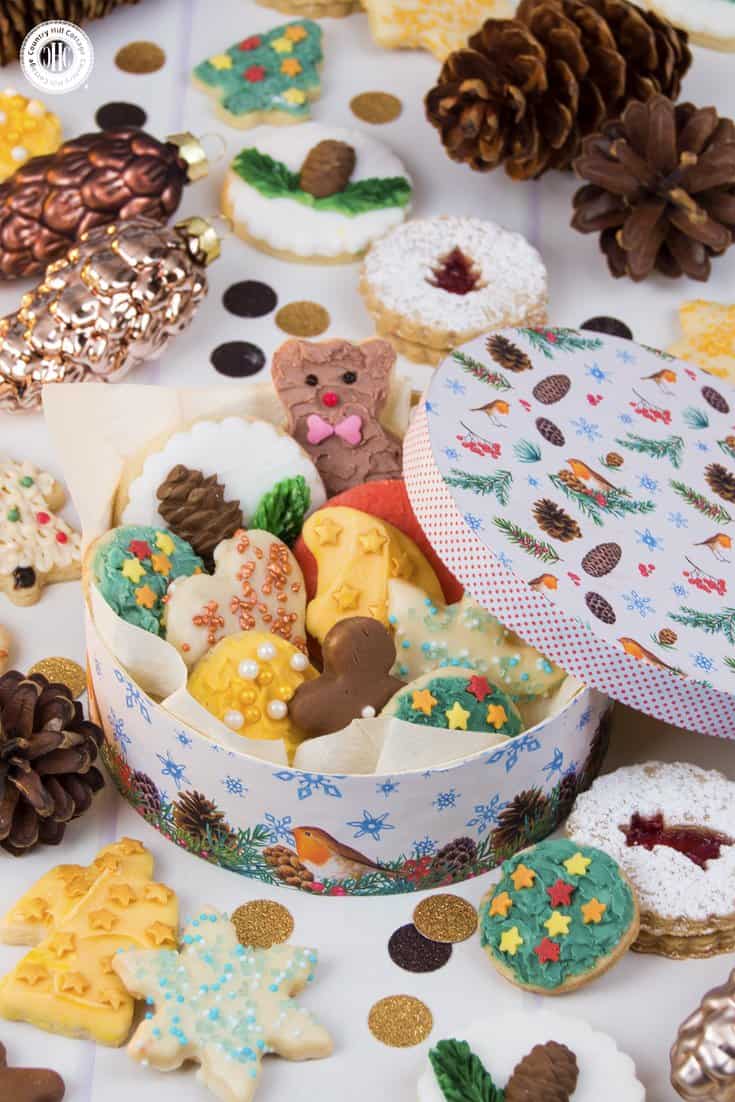 Use the decorative patterns and printable Christmas gift tags included from our free eBook to transform plain boxes into a gorgeous cookie container with decorative paper. Learn this DIY and more crafty tips in the eBook. #Christmas #printables #giftgiving #freebie | countryhillcottage.com