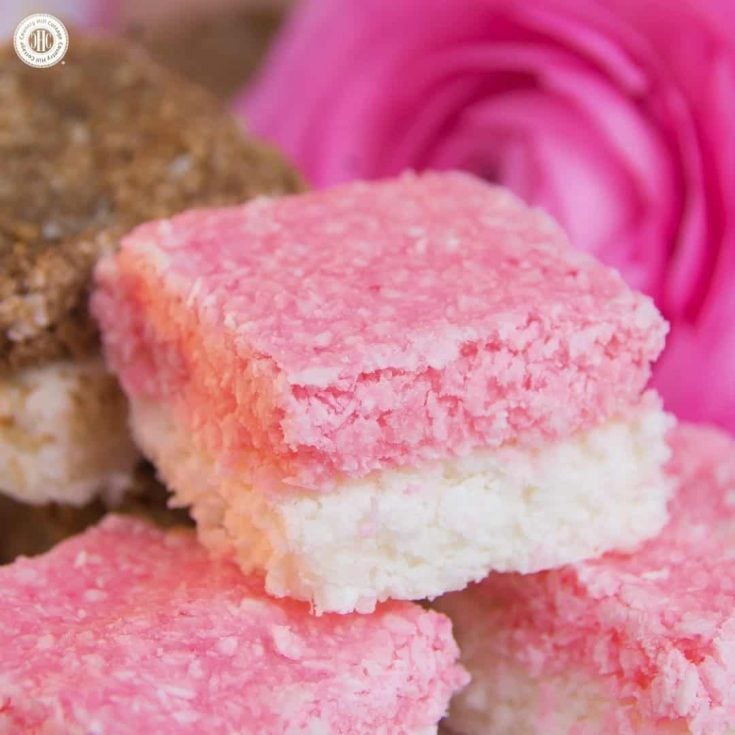 Homemade coconut ice is a sweet and easy-to-do treat, and great as wedding favours or gift for Valentine’s Day. This classic British confection is made with desiccated coconut and sweetened condensed milk and has a soft and chewy texture. This recipe only requires mixing and chilling the ingredients, plus we share a chocolate version. #coconutice #candy #foodgift | countryhillcottage.com