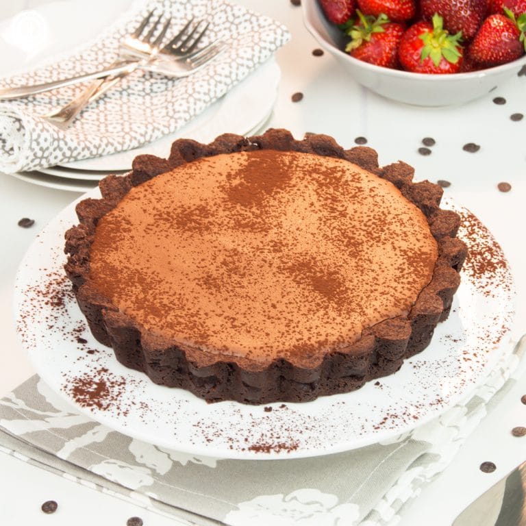 This delicious chocolate mousse tart will satisfy any and every chocolate craving! The chocolate mousse filling is easy enough to whip up and tastes very velvety and rich. The chocolate crust has a deep chocolate aroma and tender texture. The chocolate mousse tart is a wonderful way to finish an elegant dinner. You can serve the tart with whipped cream, a scoop of vanilla ice cream, and fruits. #chocolate #chocolatemousse #tart #pie #dessert #recipe | countryhillcottage.com