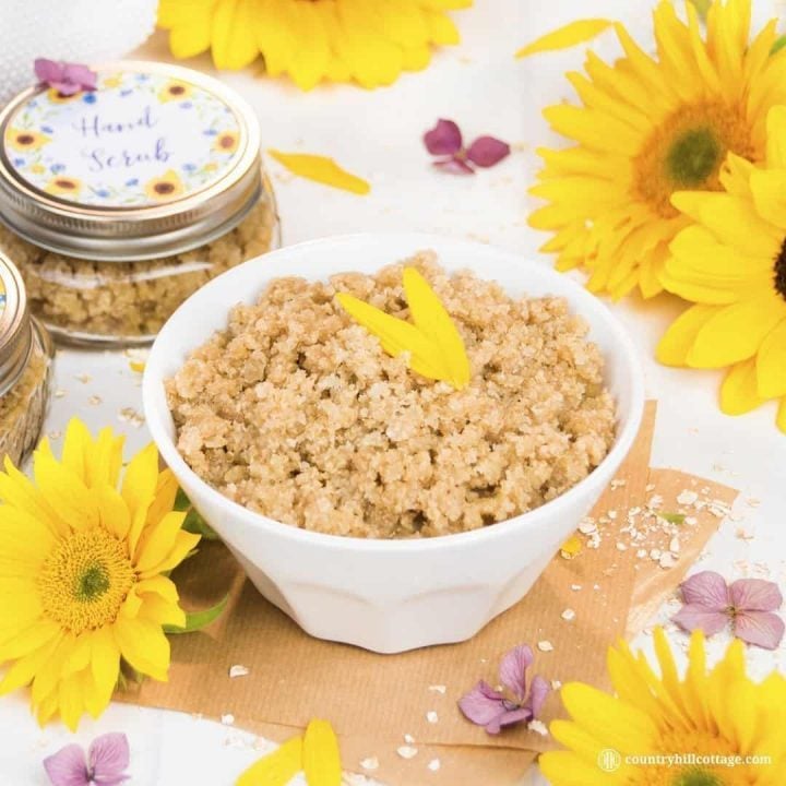Our homemade hand scrub exfoliates dull skin and is made with oats, sugar, Manuka honey, wheat germ oil and essential oils. This gentle DIY exfoliant also moisturises the skin, chapped cuticles and nails. The scrub is suitable for all skin types and can be used to exfoliate other parts of the body, such as the neck and arms. The scrub also doubles as a revitalising hand mask and makes a great DIY beauty gift. #handscrub #scrub #essentialoils #skincare | countryhillcottage.com