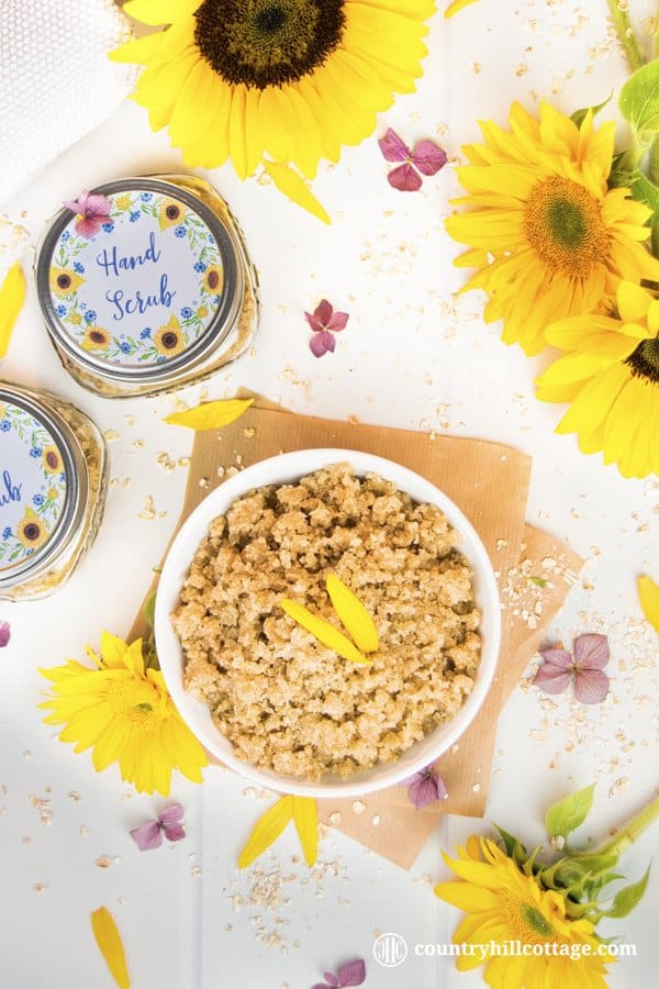 Our homemade hand scrub exfoliates dull skin and is made with oats, sugar, Manuka honey, wheat germ oil and essential oils. This gentle DIY exfoliant also moisturises the skin, chapped cuticles and nails. The scrub is suitable for all skin types and can be used to exfoliate other parts of the body, such as the neck and arms. The scrub also doubles as a revitalising hand mask and makes a great DIY beauty gift. #handscrub #scrub #essentialoils #skincare | countryhillcottage.com