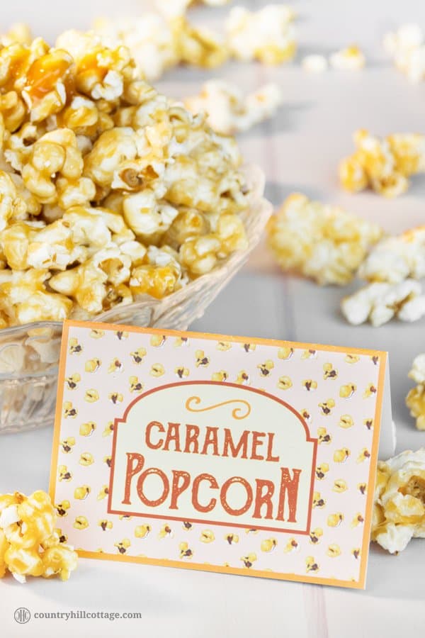 Homemade caramel popcorn is sweet, crunchy and hard to stop eating! This yummy snack is easy to whip up: pop the kernels or use premade popcorn. Then cook a thick caramel sauce with brown sugar and butter and toss the popcorn in the sauce. The recipe includes a printable retro popcorn box for gift giving or to serve at your next movie. Check out the recipe and learn how to make caramel popcorn from scratch. #caramelpopcorn #caramel #popcorn #foodgifts | countryhillcottage.com Homemade caramel popcorn is sweet, crunchy and hard to stop eating! This yummy snack is easy to whip up: pop the kernels or use premade popcorn. Then cook a thick caramel sauce with brown sugar and butter and toss the popcorn in the sauce. The recipe includes a printable retro popcorn box for gift giving or to serve at your next movie. Check out the recipe and learn how to make caramel popcorn from scratch. #caramelpopcorn #caramel #popcorn #foodgifts | countryhillcottage.com