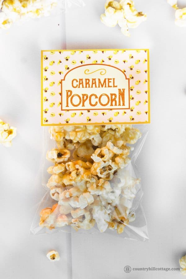 Homemade caramel popcorn is sweet, crunchy and hard to stop eating! This yummy snack is easy to whip up: pop the kernels or use premade popcorn. Then cook a thick caramel sauce with brown sugar and butter and toss the popcorn in the sauce. The recipe includes a printable retro popcorn box for gift giving or to serve at your next movie. Check out the recipe and learn how to make caramel popcorn from scratch. #caramelpopcorn #caramel #popcorn #foodgifts | countryhillcottage.com Homemade caramel popcorn is sweet, crunchy and hard to stop eating! This yummy snack is easy to whip up: pop the kernels or use premade popcorn. Then cook a thick caramel sauce with brown sugar and butter and toss the popcorn in the sauce. The recipe includes a printable retro popcorn box for gift giving or to serve at your next movie. Check out the recipe and learn how to make caramel popcorn from scratch. #caramelpopcorn #caramel #popcorn #foodgifts | countryhillcottage.com