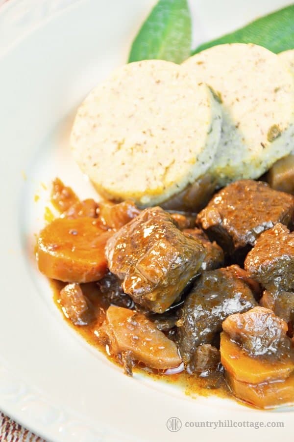 This easy beef stew recipe makes a sumptuous supper and is perfect for cheaper cuts. Our traditional braised beef stew is made with root veggies, fresh herbs, red wine and tasty broth. A slow cooking time guarantees tender meat and a flavourful gravy. The recipe includes instructions for cooking the beef stew on a stove top, in the oven or slow cooker, as well as tips for the type of beef cut you need, seasoning and other ingredients. #beef #stew #beefstew #stewrecipe | countryhillcottage.com
