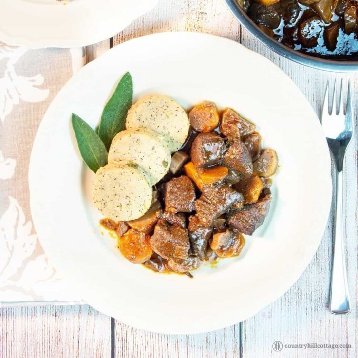 This easy beef stew recipe makes a sumptuous supper and is perfect for cheaper cuts. Our traditional braised beef stew is made with root veggies, fresh herbs, red wine and tasty broth. A slow cooking time guarantees tender meat and a flavourful gravy. The recipe includes instructions for cooking the beef stew on a stove top, in the oven or slow cooker, as well as tips for the type of beef cut you need, seasoning and other ingredients. #beef #stew #beefstew #stewrecipe | countryhillcottage.com