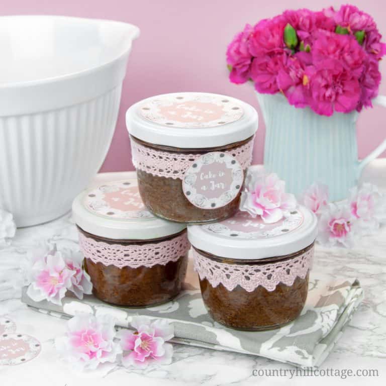 Bake moist and scrumptious chocolate cakes in a jar and indulge your friends and family! It all starts with a delicious one-bowl chocolate batter, laden with white chocolate chunks. The batter is then baked in sterilised jars and sealed immediately after baking, which gives cakes in a jar a long shelf life. You can easily prepare them in advance and have them at hand when you need a delicious homemade food gift. #cakesinajar #chocolatecake #foodgift #cakeinajar | countryhillcottage.com
