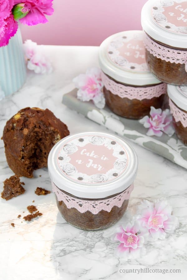 Bake moist and scrumptious chocolate cakes in a jar and indulge your friends and family! It all starts with a delicious one-bowl chocolate batter, laden with white chocolate chunks. The batter is then baked in sterilised jars and sealed immediately after baking, which gives cakes in a jar a long shelf life. You can easily prepare them in advance and have them at hand when you need a delicious homemade food gift. #cakesinajar #chocolatecake #foodgift #cakeinajar | countryhillcottage.com Bake moist and scrumptious chocolate cakes in a jar and indulge your friends and family! It all starts with a delicious one-bowl chocolate batter, laden with white chocolate chunks. The batter is then baked in sterilised jars and sealed immediately after baking, which gives cakes in a jar a long shelf life. You can easily prepare them in advance and have them at hand when you need a delicious homemade food gift. #cakesinajar #chocolatecake #foodgift #cakeinajar | countryhillcottage.com