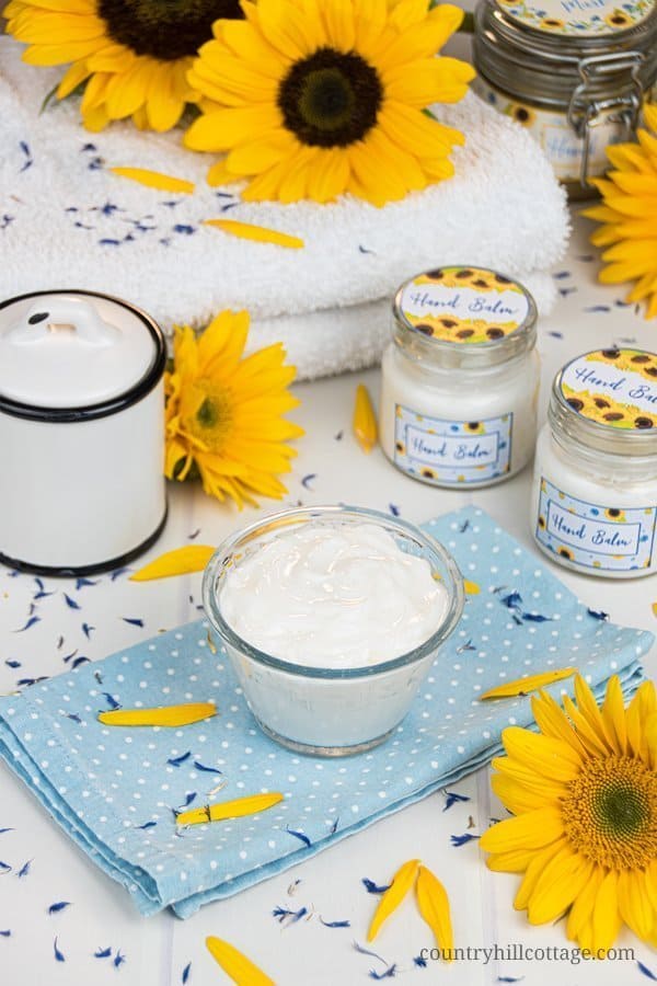 Formulated with natural ingredients and essential oils, this easy homemade hand cream moisturises and revitalizes tough, dried out hands. The non greasy DIY hand lotion absorbs quickly and locks moisture in the skin, making your hands feel silky smooth and healthy. Learn how to make this lotion recipe perfect for dry skin and anti aging. This beauty products also make a cute gift and comes with a packaging idea. #handcream #lotion #moisturizer #essentialoils #skincare | countryhillcottage.com