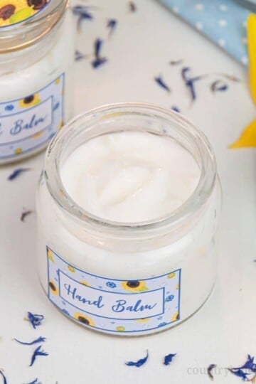 Formulated with natural ingredients and essential oils, this easy homemade hand cream moisturises and revitalizes tough, dried out hands. The non greasy DIY hand lotion absorbs quickly and locks moisture in the skin, making your hands feel silky smooth and healthy. Learn how to make this lotion recipe perfect for dry skin and anti aging. This beauty products also make a cute gift and comes with a packaging idea. #handcream #lotion #moisturizer #essentialoils #skincare | countryhillcottage.com