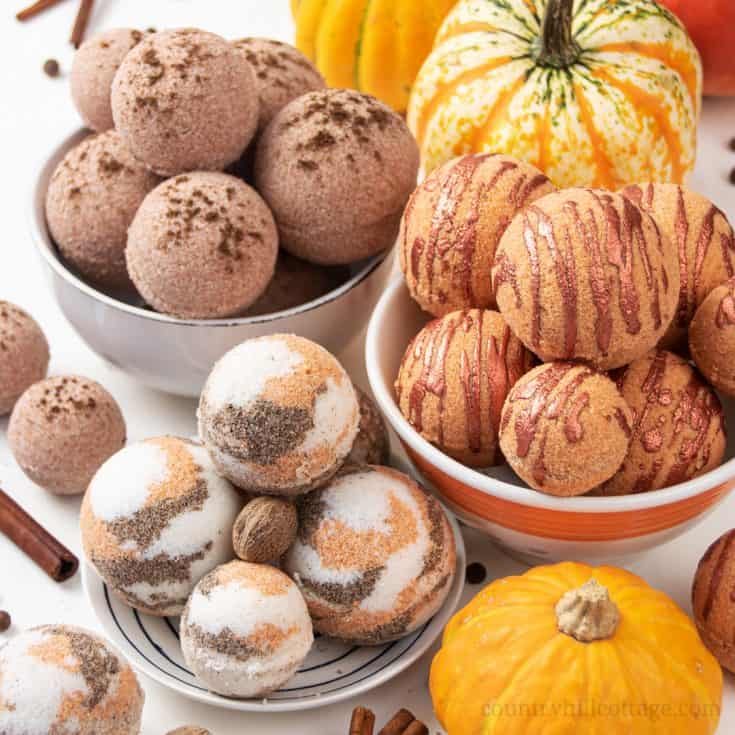 Learn how to make 3 simple natural DIY bath bomb recipes without cornstarch! Pretty pumpkin spice bath bombs have a lovely scent & create cozy fall vibes while you relax in the tub. These easy homemade bath bombs with essential oils are very fizzy and made with moisturizing ingredients that hydrate your skin while you enjoy the aromatherapy benefits. Perfect for kids & a great holiday gift idea for Halloween & Christmas. #bathbombs #aromatherapy #fall #essentialoils | countryhillcottage.com