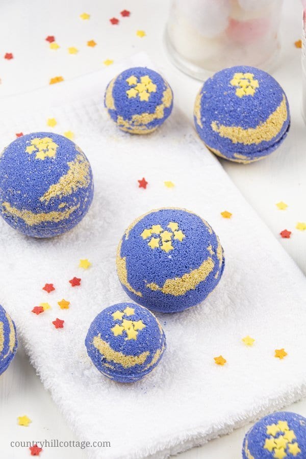 DIY foaming bath bombs with shea butter help to relax and promote a good night’s sleep. Calm your mind, relieve stress, and create a spa-worthy bath ritual to unwind. Homemade foaming bath fizzies add fizz and bubbles to the water and turn bath time into a fun excitement for kids and adults. Shea butter leaves the skin well nourished and moisturized. Essential oils immerse the senses and relaxes mind and body. #bathbombs #essentialoils #aromatherapy #sheabutter #beautydiy| countryhillcottage.com
