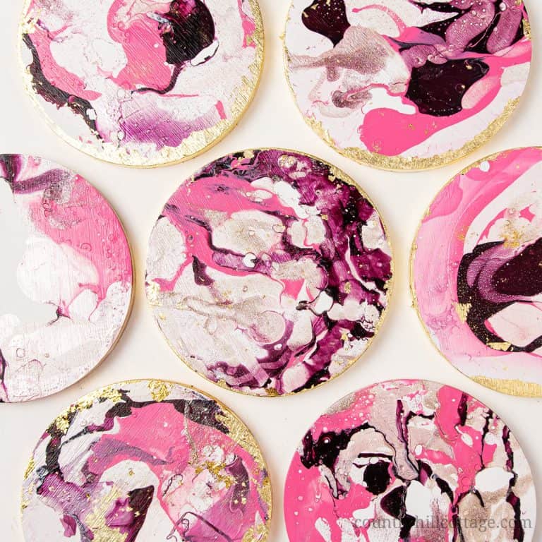 Learn how to make beautiful round gold marble DIY coasters that look like Anthropologie agate coasters! Cute homemade coasters are fun and easy and make a stunning handmade gift for friends and family. The modern handmade coasters are painted with nail polish and are finished in no time. This simple DIY project can be made with wooden coasters or ceramic tiles. A great craft for adults and kids, unique & elegant home decor! #coasters #marble #DIYcoaster #diy #agate | countryhillcottage.com
