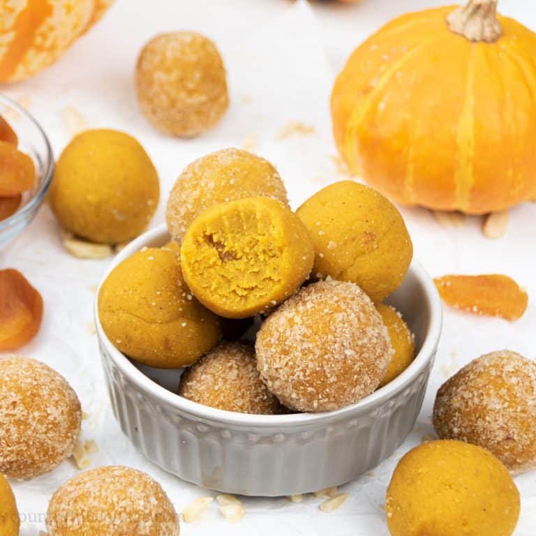 Learn how to make vegan no-bake pumpkin energy balls! Made in the food processor with pumpkin spice, raw almonds and coconut flour, this easy homemade energy bites recipe makes delicious pumpkin truffles. The pumpkin balls taste like pumpkin pie, donut holes & cake bites. This quick healthy snacks recipe is gluten-free, paleo & Whole30. ideal for kids, clean eating, breakfast, lunch or dessert. Grain fee, no added sugar, dairy free. #energyballs #vegan #nobake #pumpkin | countryhillcottage.com