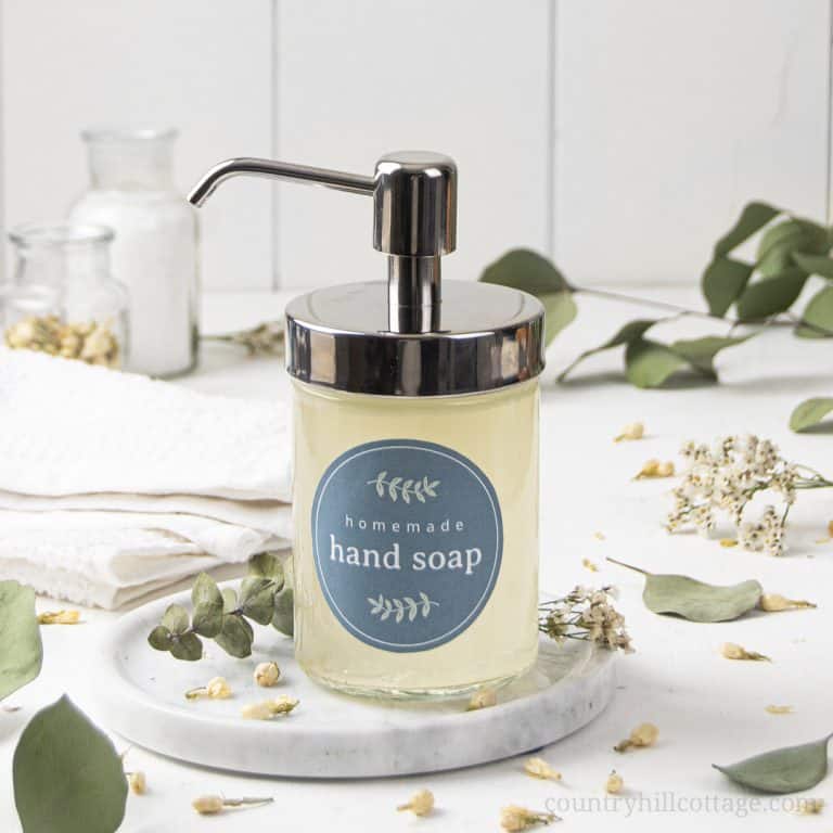 This vegan DIY antibacterial soap with essential oils is a gentle way to clean your hands! See how to make the best homemade liquid handwash with natural organic ingredients at home. The simple soap making recipe is great for beginners. Safe for kids, won’t dry out the skin. The easy antibacterial hand and body soap includes tips for containers, supplies, uses and free printable for packaging. Step by step liquid soap tutorial. #liquidsoap #handsoap #antibacterial #soap| countryhillcottage.com