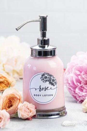 See how to make easy, non greasy DIY rose body lotion with essential oils, vitamin E and natural ingredients. The simple homemade pumpable rose water lotion recipe without beeswax, coconut oil, or shea butter is suitable for firming, dry skin, eczema and sensitive skin. The moisturizing rose lotion recipe is suitable for all skin types. With tips for rose body butter, packaging in pump dispenser bottles, storage and the best shelf life. #roselotion #bodylotion #skincare| countryhillcottage.com