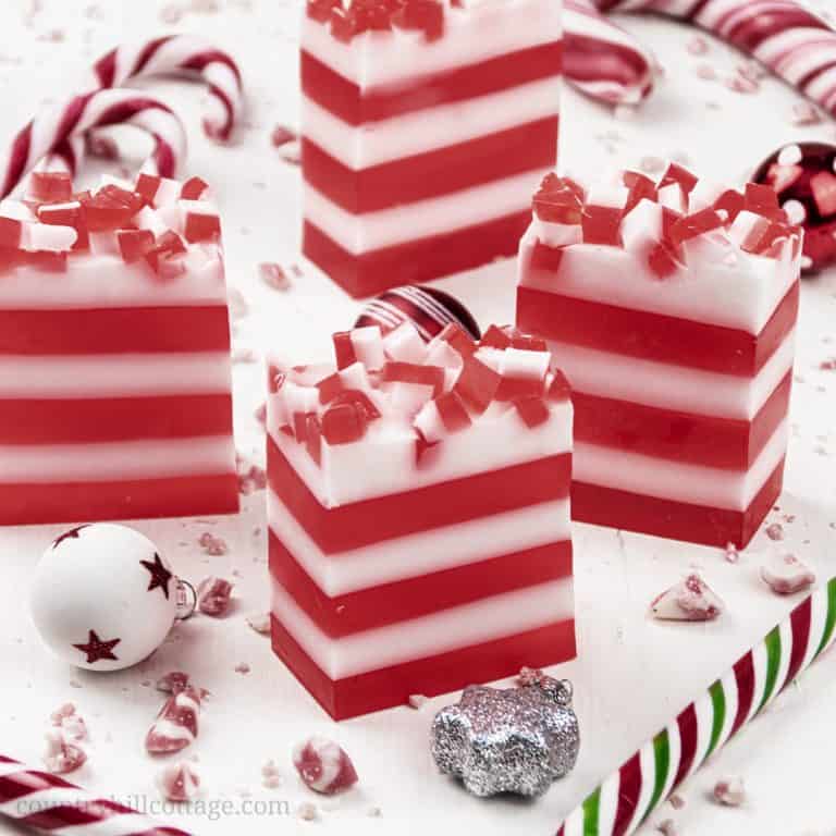 See how to make DIY candy cane soap! This easy peppermint soap recipe has many skincare benefits and is made with melt and pour soap and essential oils for a natural mint scent. The simple handmade Christmas soap bar looks very festive and is a great homemade holiday gift idea. The step by step tutorial is great for beginners and comes with tips for making, use and packaging ideas. #soap #peppermintsoap #meltandpour #holidaygift #essentialoils #candycane #Christmas | countryhillcottage.com