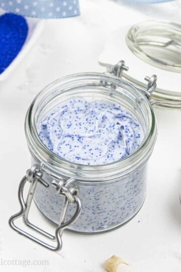 Learn how to make an exfoliating DIY cleansing balm with jojoba beads! This vegan facial scrub is a four-in-one treatment: the non-comedogenic oils are a make up remover and natural skincare moisturizer, kaolin clay draws out impurities and cleanses, and the jojoba beads exfoliate your face. This gentle face polish recipe and non-abrasive homemade exfoliator is suitable for dry skin, oily skin, and acne. #cleansingbalm #facescrub #facialscrub #facepolish #jojobabeads | countryhillcottage.com