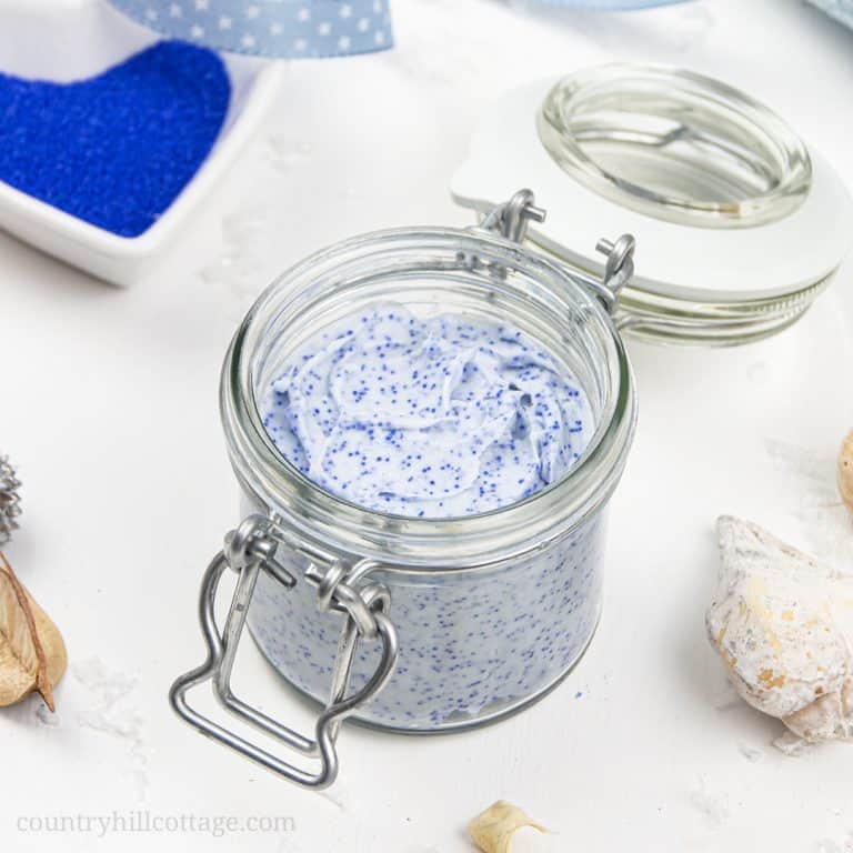 Learn how to make an exfoliating DIY cleansing balm with jojoba beads! This vegan facial scrub is a four-in-one treatment: the non-comedogenic oils are a make up remover and natural skincare moisturizer, kaolin clay draws out impurities and cleanses, and the jojoba beads exfoliate your face. This gentle face polish recipe and non-abrasive homemade exfoliator is suitable for dry skin, oily skin, and acne. #cleansingbalm #facescrub #facialscrub #facepolish #jojobabeads | countryhillcottage.com