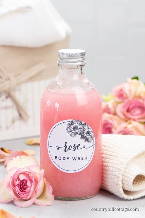 See how to make moisturizing vegan DIY rose body wash recipe without castile soap that lathers an is best smelling! The easy liquid homemade shower gel is a mild cleanser great for eczema, acne, dry and sensitive skin. This pH-balanced rose water body wash foams beautifully, has a rich lather and lush gel texture. The tutorial shows how to make good foaming all natural body wash with organic coconut oil, glycerin and essential oils plus tips for bottles and packaging. | countryhillcottage.com