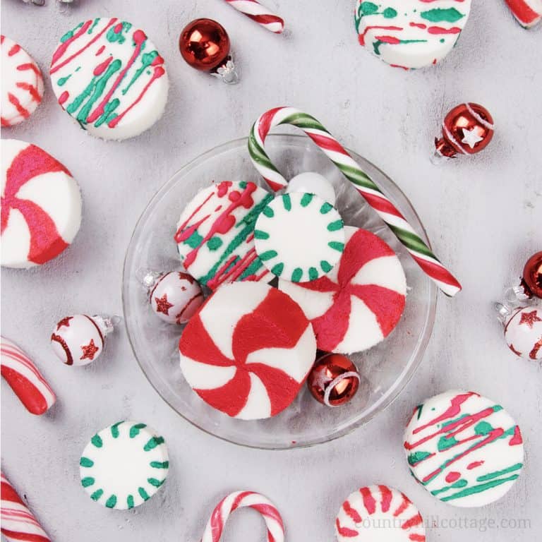 See how to make DIY peppermint bath bombs with essential oils! You learn how to make an easy homemade candy cane essential oil blend and tricks to paint the bath fizzies with mica for pretty bath fizzies! This easy Christmas bath bomb recipe looks and smells very festive and is an excellent handmade bath gift idea for the holiday season. Great for kids. With storage tips, packaging ideas and printable gift tags. #peppermint #bathbombs #Christmas #gift #essentialoils | countryhillcottage.com