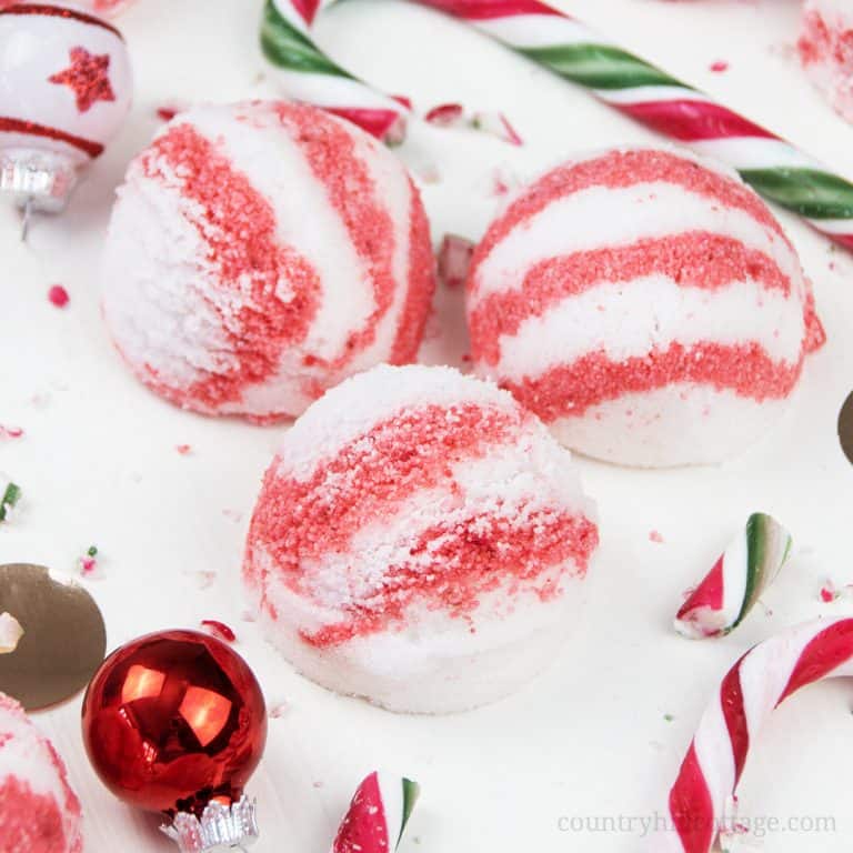 Learn how to make DIY peppermint bubble scoops for Christmas! Made with essential oils, citric acid, baking soda, moisturizing coconut oil and an ice cream scoop, these DIY bath truffles soften the skin and create long-lasting bubbles. This solid bubble bar recipe is easier to make than bath bombs and a great homemade holiday bath spa gifts. Tutorial with step-by-step instructions and packaging ideas. #bubblescoop #bathtruffle #bathbomb #bubblebar #essentialoils #gift | countryhillcottage.com