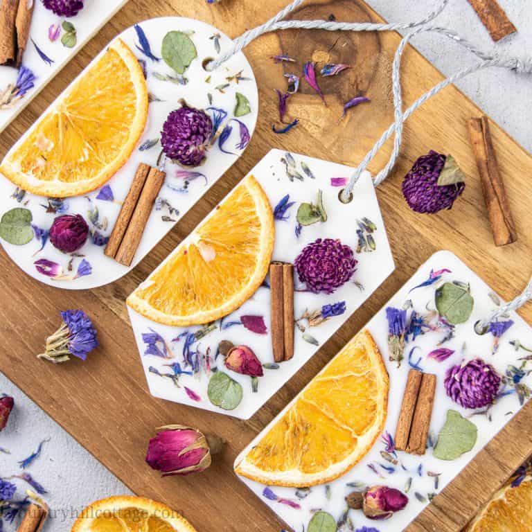 How to make DIY scented wax sachets with soy wax, essential oils and dried botanicals. Simple homemade natural wax air freshener is a long lasting odor eliminator to fragrance closets, drawers and other small spaces. The recipe makes cute Christmas gifts, decor, wedding favor or souvenir. Includes pink rose fragrance and lavender aroma hexagon scented sachets. With tips for uses, where to put, 6 designs and printable gift tags for packaging. #homefragrance #essentialoils| countryhillcottage.com