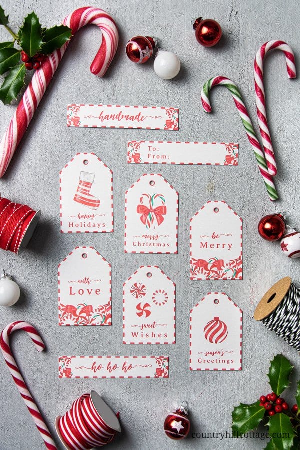Decorate Christmas presents with free printable candy cane gift tags! These pretty DIY holiday gift tags are an easy seasonal craft project and are a wonderful way to dress up handmade holiday gifts. Tap the image to download this set of 9 Christmas gift tag printables and gift wrap your goodies in style! The simple candy cane design is great for teachers, kids, neighbors and friends. #gifttag #holidaygifttags #christmasgifttags #gift #tag #DIYtags #Christmas #Holidays | countryhillcottage.com