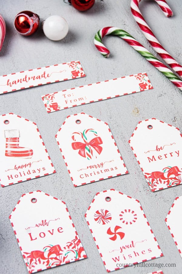 Decorate Christmas presents with free printable candy cane gift tags! These pretty DIY holiday gift tags are an easy seasonal craft project and are a wonderful way to dress up handmade holiday gifts. Tap the image to download this set of 9 Christmas gift tag printables and gift wrap your goodies in style! The simple candy cane design is great for teachers, kids, neighbors and friends. #gifttag #holidaygifttags #christmasgifttags #gift #tag #DIYtags #Christmas #Holidays | countryhillcottage.com
