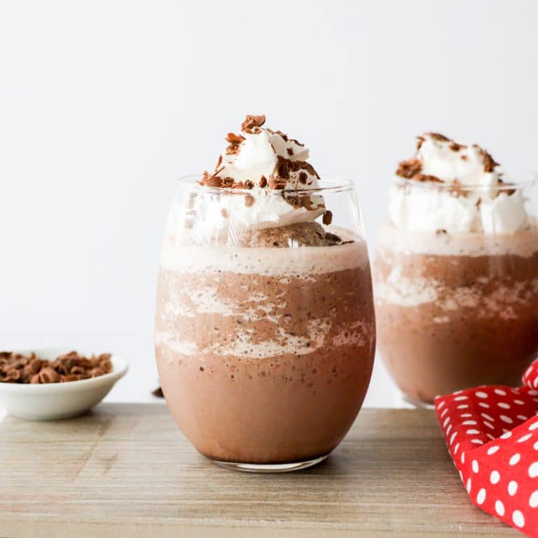 Quick and easy frozen hot chocolate recipe is the perfect cold beverage for hot summer days. It’s a great way to enjoy hot chocolate all year long, even on hot days. This refreshing drink has a delicious chocolate flavor and a milkshake-like texture. Learn how to make this yum, non-alcoholic summer drink, that kids and your family will love. #frozendrinks #hotchocolate #frozenhotchocolate #beverage #chocolate #summer #easy | countryhillcottage.com