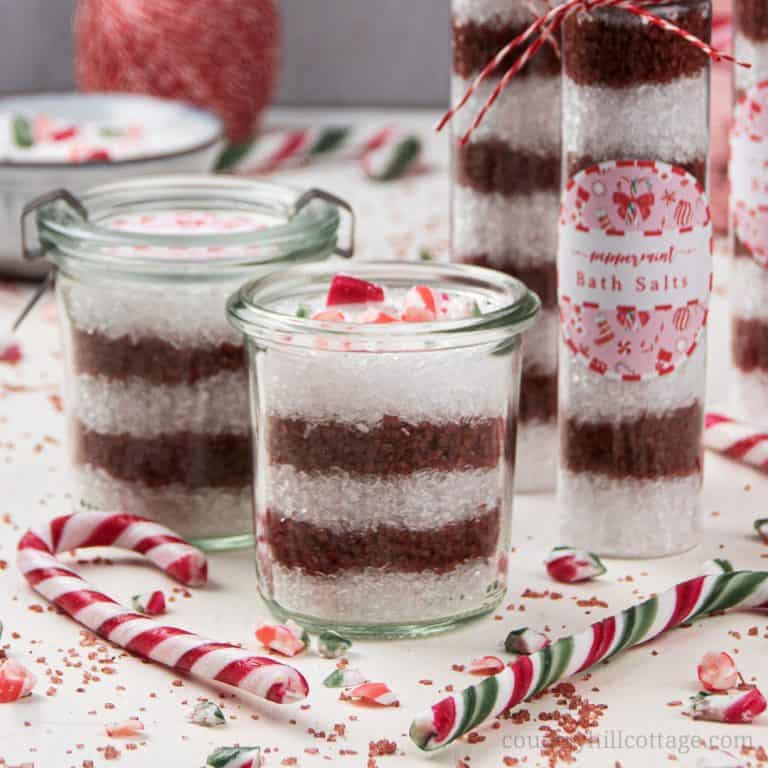 See how to make pretty DIY peppermint bath salts with Alaea red Hawaiian salt and with essential oils. Red and white candy cane bath salts are perfect to relax in the tub and make an excellent holiday gift. This homemade Christmas bath salt recipe comes with packaging ideas and free printable labels for packaging and gifting. The all-natural bath soak with peppermint essential oil is a great handmade holiday present. #bathsalt #bathsalts #essentialoils #bathsoak #gift | countryhillcottage.com