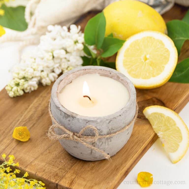 See how to make the best DIY citronella candles with essential oils that repel mosquitos! These non-toxic outdoor candles are a natural bug repellent and ward off mosquitoes and other insects. The homemade citronella candle recipe is a summer patio and party staple to protect you from pesky bug bites! The easy soy candle making tutorial includes tips for mason jars, fragrance scent blends and printable labels for gifts. A great beginner candle making recipe! #candles | countryhillcottage.com