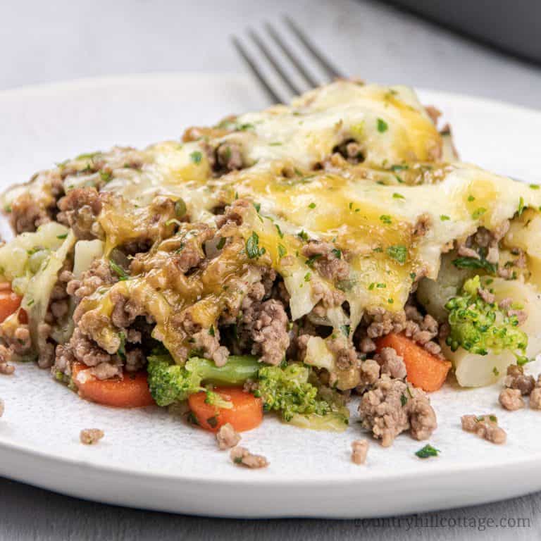 This easy low carb keto ground casserole recipe with cauliflower and stir fry broccoli is a quick dinner idea for families dish and great for weeknight meals and midweek dishes. Simple keto ground beef recipe is gluten-free comfort food and perfect to feed a crowd or for a potluck. The healthy casserole recipe also includes seasoning tips and variations (cheeseburger casserole) for the best skinny beef casserole ever. #casserole #ketocasserole #groundbeef #lowcarb #keto | countryhillcottage.com