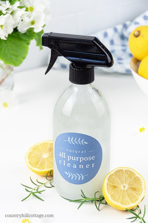 See how to make the best natural DIY all purpose cleaner recipe with essential oils! The homemade zero waste mildly disinfectant cleaning spray can be made with vodka, rubbing alcohol, Dr Bronners castile soap, Sal Suds, Dawn, Thieves, On Guard, washing soda, baking soda, hydrogen peroxide and lemon EO. Easy method for how to make your own DIY Mrs Meyers without vinegar, without borax. Safe for marble and granite, plus printable labels #cleaner #cleaning #greenliving | countryhillcottage.com