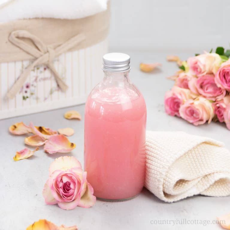 See how to make moisturizing vegan DIY rose body wash recipe without castile soap that lathers an is best smelling! The easy liquid homemade shower gel is a mild cleanser great for eczema, acne, dry and sensitive skin. This pH-balanced rose water body wash foams beautifully, has a rich lather and lush gel texture. The tutorial shows how to make good foaming all natural body wash with organic coconut oil, glycerin and essential oils plus tips for bottles and packaging. | countryhillcottage.com