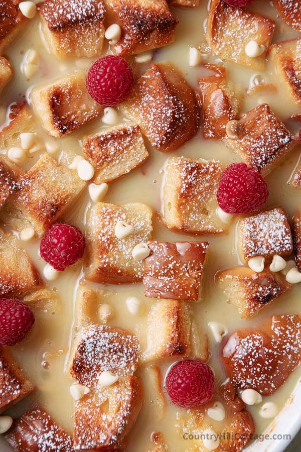 close-up of raspberry white chocolate bread pudding.