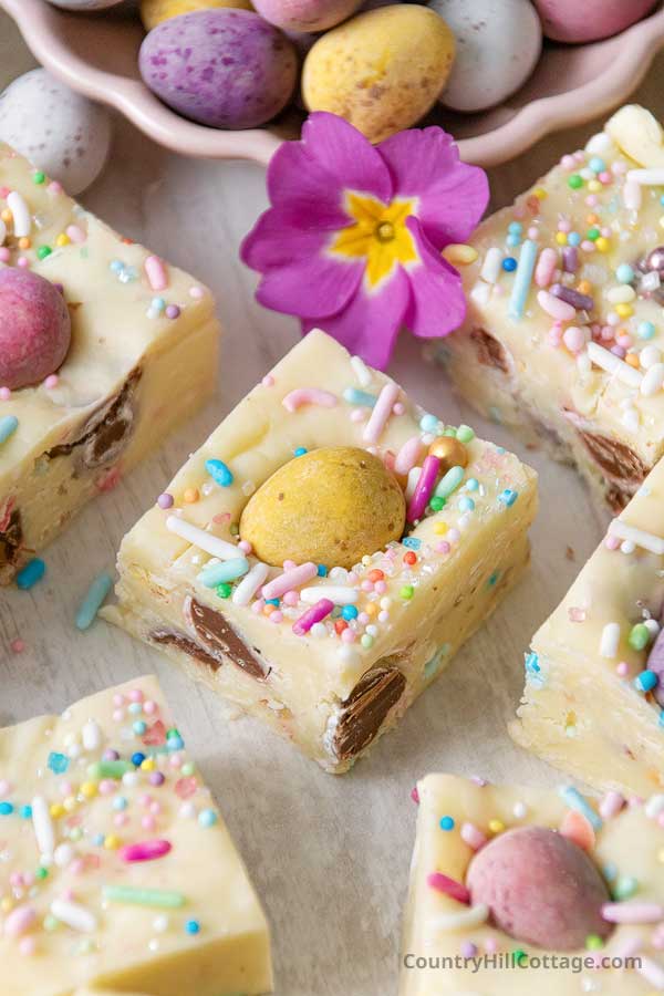 Easter fudge square surrounded by more fudge pieces and mini eggs.